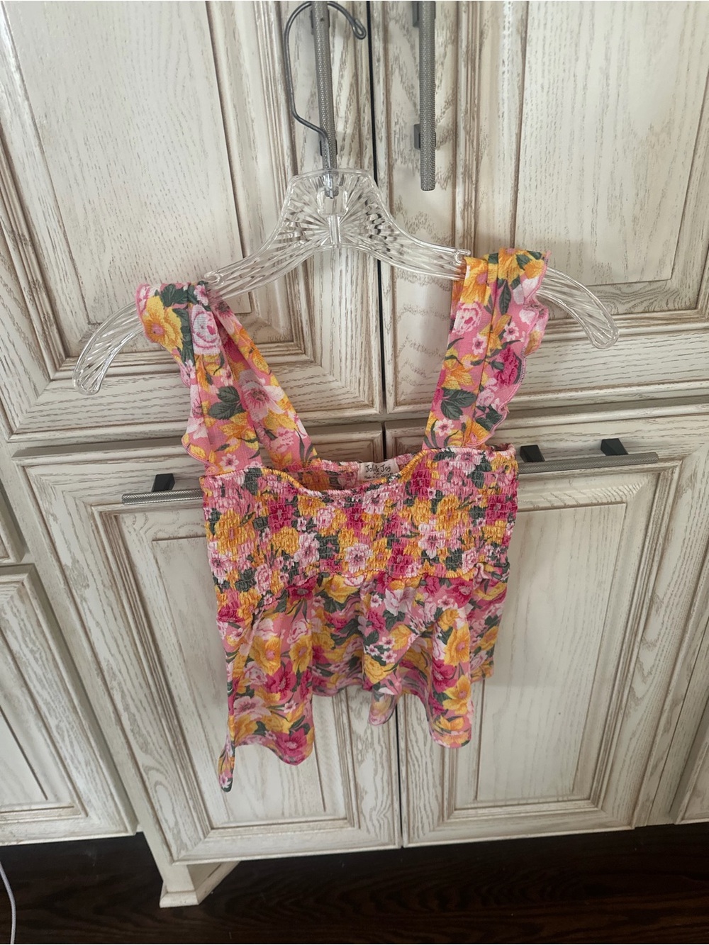 Jolie & Joy tank top featuring a smocked bodice and ruffle shoulder straps.